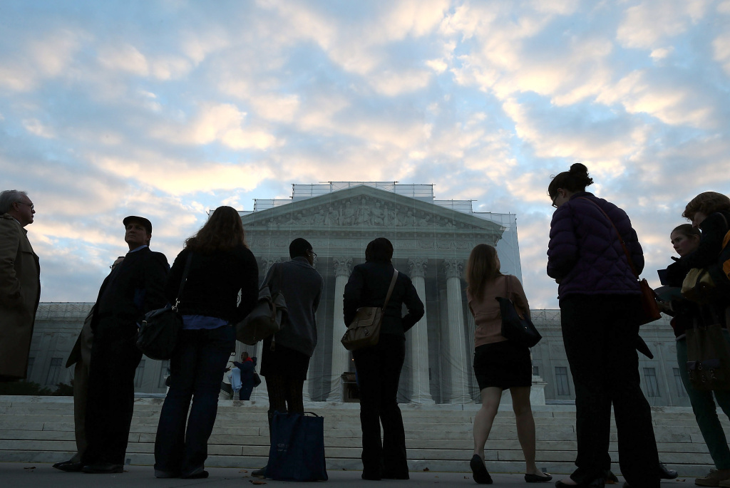 The Supreme Court Hears Hears Affirmative Action Case Regarding Admissions To Texas University People wait in line to enter the U.S. Supreme Court on October 10, 2012 in Washington, DC.