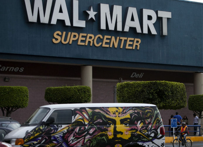 A van covered by a mural sits parked outside a Wal-Mart Super Center in Mexico City. Wal-Mart Stores Inc. hushed up a vast bribery campaign that top executives of its Mexican subsidiary carried out to build stores across Mexico, according to a published report by the New York Times. On Thursday, U.S. lawmakers released emails that show that Wal-Mart Stores Inc.'s CEO found out in 2005 that the retailer was handing out bribes in Mexico. A van covered by a mural sits parked outside a Wal-Mart Super Center in Mexico City. Wal-Mart Stores Inc. hushed up a vast bribery campaign that top executives of its Mexican subsidiary carried out to build stores across Mexico, according to a published report by the New York Times. On Thursday, U.S. lawmakers released emails that show that Wal-Mart Stores Inc.'s CEO found out in 2005 that the retailer was handing out bribes in Mexico.
