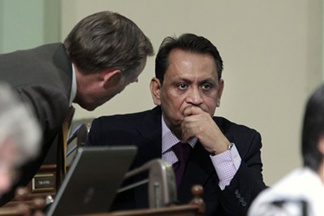 Assemblyman Jared Huffman, D-San Rafael, left, talks with Assembly member Gil Cedillo, D-Los Angeles, at the Capitol last year.