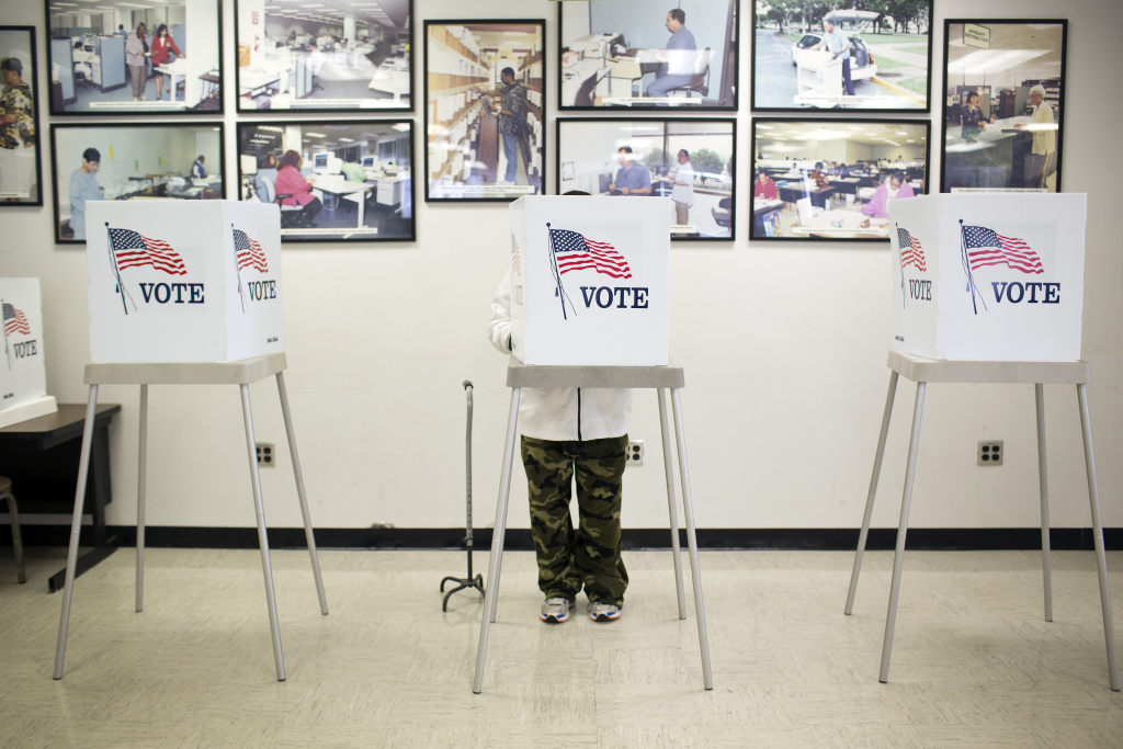 Voting Registration - 3 Voters vote early at the Los Angeles County Registrar/Recorder building in Norwalk on Friday, Oct. 17. Early voting will also take place the two weekends leading up to election day on Nov. 4.