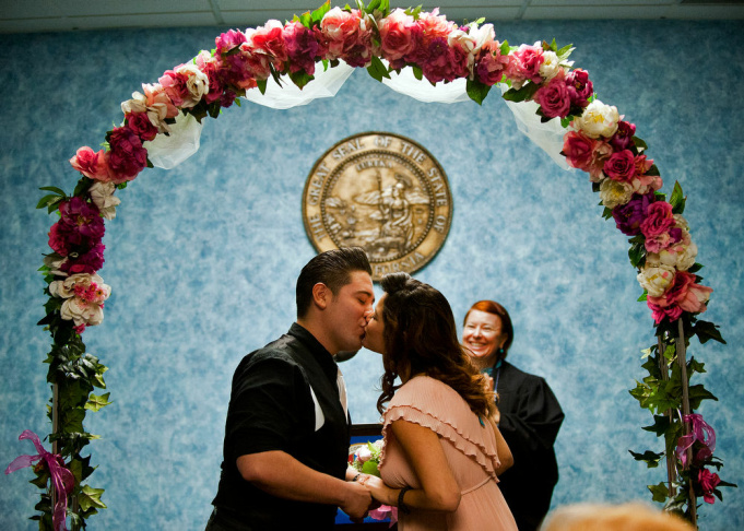 Season S Givings Volunteers Needed To Perform Los Angeles County Rick And Jessica Garcia Of West Covina Kiss After They Are Married By Volunteer Elizabeth Oakes