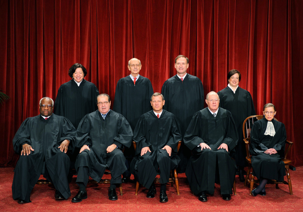 The Justices of the US Supreme Court sit The Justices of the US Supreme Court sit for their official photograph on October 8, 2010 at the Supreme Court in Washington, DC. Front row (L-R): Associate Justice Clarence Thomas, Associate Justice Antonin Scalia, Chief Justice John G. Roberts, Associate Justice Anthony M. Kennedy and Associate Justice Ruth Bader Ginsburg. Back Row (L-R): Associate Justice Sonia Sotomayor, Associate Justice Stephen Breyer, Associate Justice Samuel Alito Jr. and Associate Justice Elena Kagan. AFP PHOTO / TIM SLOAN (Photo credit should read TIM SLOAN/AFP/Getty Images)