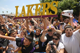 Fans cheer for the Los Angeles Lakers during their victory parade for the the NBA basketball champion team on June 21, 2010 in Los Angeles, California.