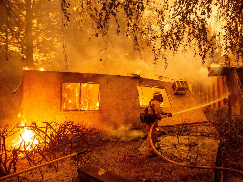 Firefighters battle flames at a burning apartment complex in Paradise, California in November. State fire officials say power lines coming into contact with trees have sparked multiple Northern California wildfires in recent years. PG&E submitted its Firefighters battle flames at a burning apartment complex in Paradise, California in November. State fire officials say power lines coming into contact with trees have sparked multiple Northern California wildfires in recent years. PG&E submitted its