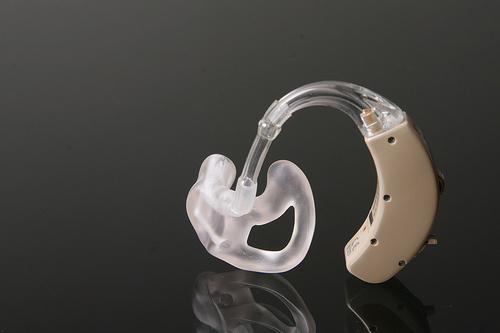 hearing aid Hearing aids can help alleviate hearing loss, but are often prohibitively expensive.