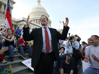 Republican Rep. Jack Kingston of Georgia, speaks to people demonstrating against the health care bill on the U.S. Capitol steps Saturday.