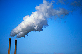 Greenhouse gases being emitted into the atmosphere.