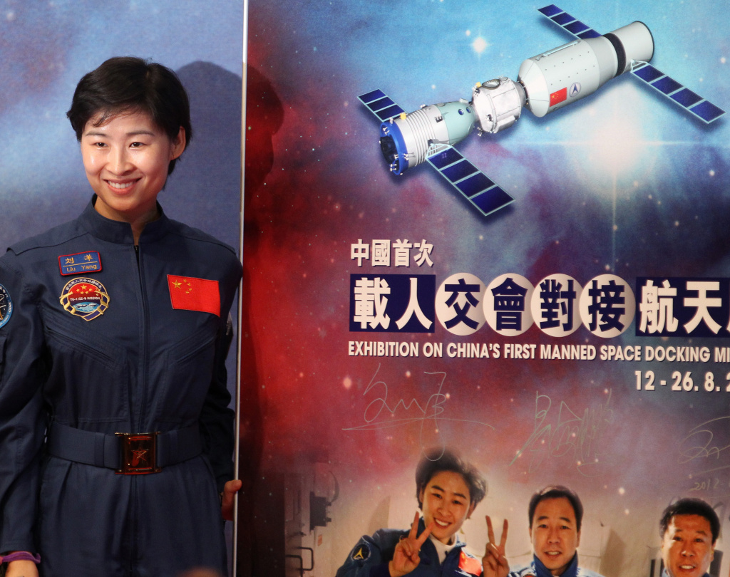 Chinese astronaut Liu Yang of the Tiango Chinese astronaut Liu Yang of the Tiangong-1/Shenzhou-9 Manned Space Docking and Rendezvous Mission delegation poses for photographs during the opening ceremony of an exhibition on China's first manned space docking mission in Hong Kong on August 12, 2012.