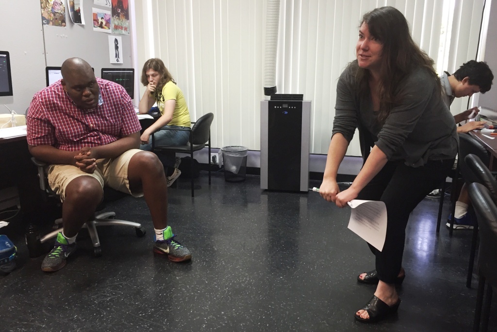 exceptional minds Instructor Kat Cutright gets physical, illustrating the basics concepts of animation with her body, during a summer program at Exceptional Minds.