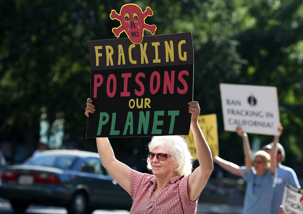 Activists Rally Against Fracking Outside California EPA Office Protestors hold signs against fracking during a demonstration outside of the California Environmental Protection Agency (EPA) headquarters on July 25, 2012 in Sacramento, California. Dozens of environmental activists staged a