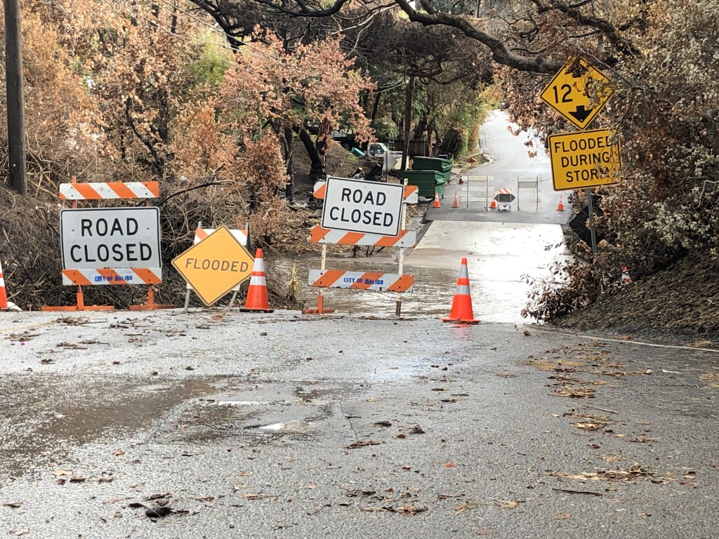 Malibu mudslides A residential street is underwater when four inches of rain flood Malibu in two days.