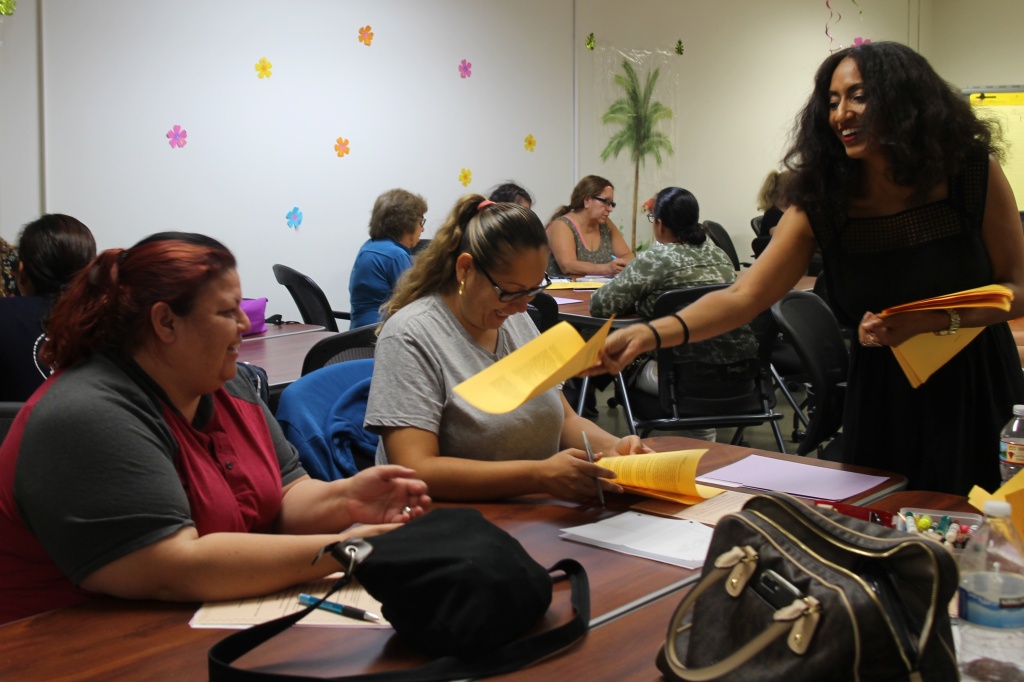 ECE Apprenticeship program Christine Wilson, an adjunct professor with Los Angeles Trade Technical College, hands out a syllabi for her Infant and Toddler course.