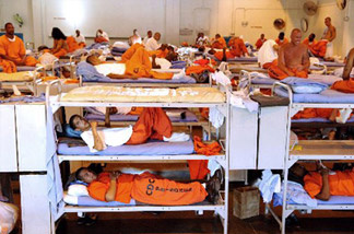 Mercer 624 California prisoners in a crowded gymnasium.