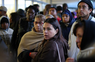 People wait in line before dawn for free healthcare service at the Remote Area Medical (RAM) clinic at the Los Angeles Sports Arena on April 27, 2010 in Los Angeles.