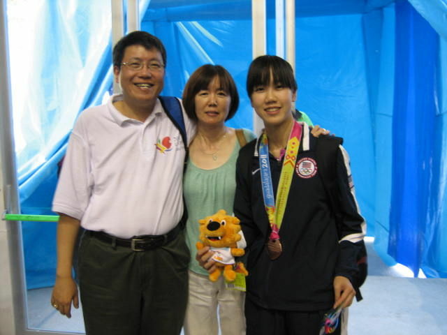 Erica with her parents in Guadalajara, Mexico Erica with her parents in Guadalajara, Mexico after winning the bronze medal with the U.S. Women's Table Tennis team. Now she's going for the gold, after qualifying for Team USA's Olympic team.