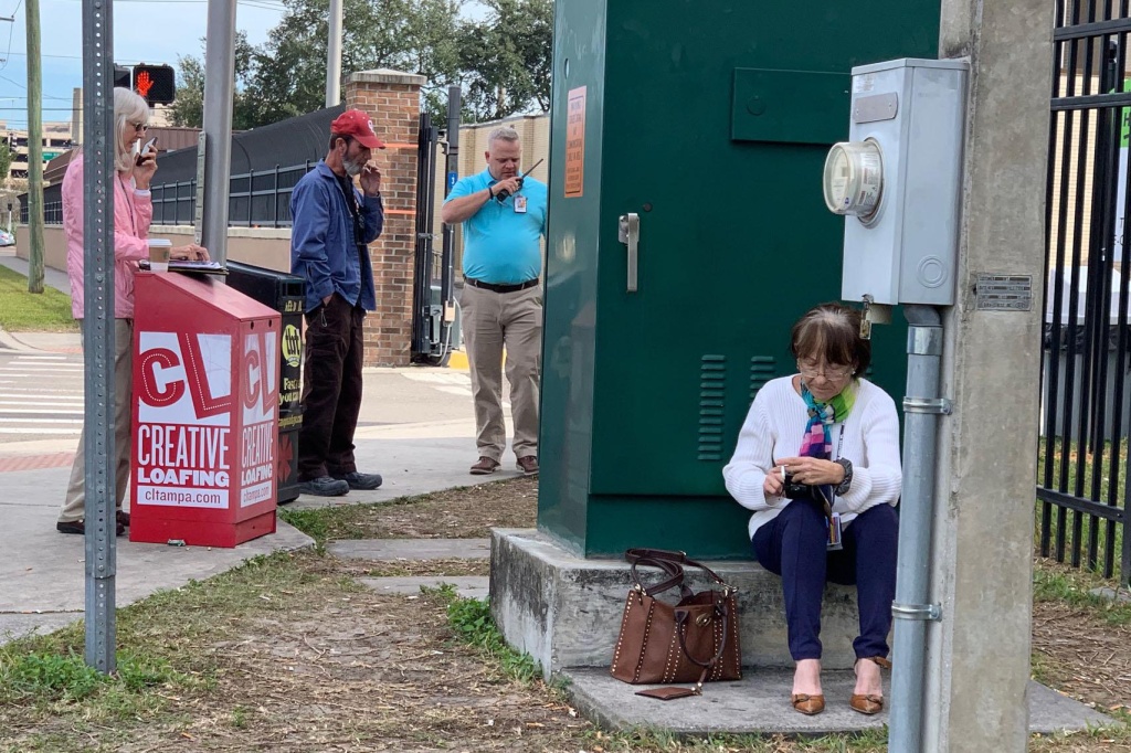 Smokers congregate outside the fence of the VA hospital in Tampa. Smokers congregate outside the fence of the VA hospital in Tampa.