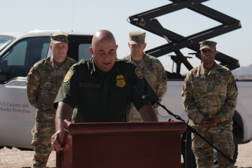 American Homefront Border Troops Border Patrol spokesman Ramiro Cordero appears with service members at a June press conference in Sunland Park, New Mexico.