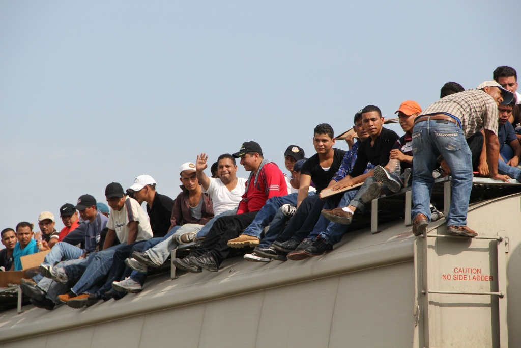 MEXICO-US-MIGRATION Central American immigrants sit atop the so-called La Bestia (The Beast) cargo train, in an attempt to reach the Mexico-US border, in Arriaga, Chiapas state, Mexico on July 16, 2014.