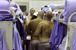 Mercer 18186 Inmates at the Mule Creek State Prison crowd between bunk beds in a gymnasium that was modified to house prisoners in Ione, California. The Mule Creek State Prison has had to modify several facilities to make room for an increasing number of inmates.