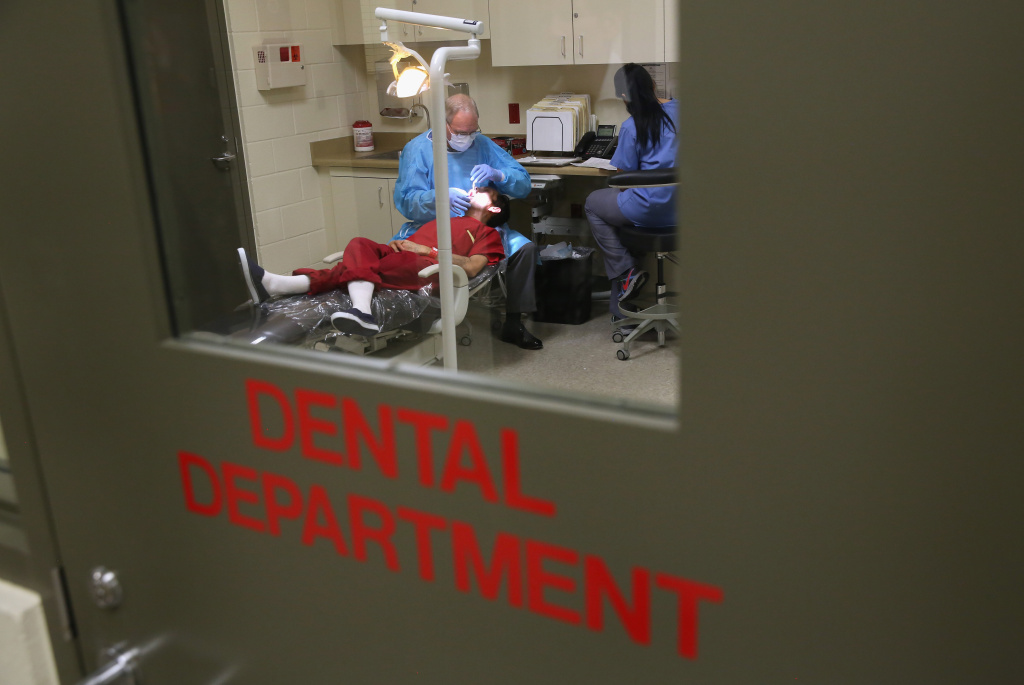 ICE Holds Immigrants At Adelanto Detention Facility An immigrant receives dental care at the Adelanto Detention Facility on Nov. 15, 2013 in Adelanto.