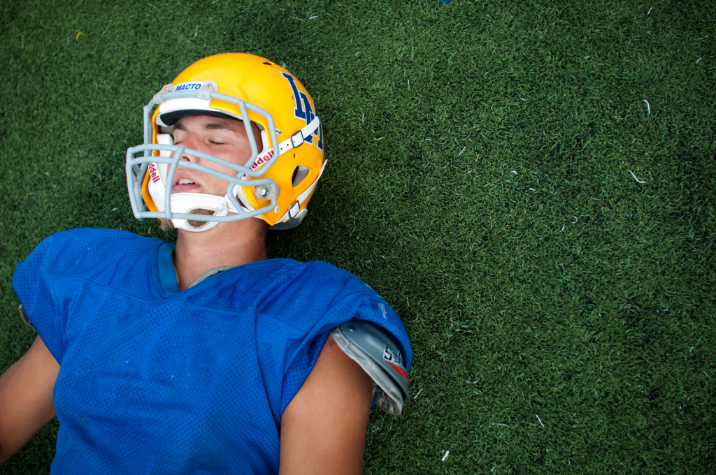 Kevin Dillman - 1 Kevin Dillman, 16, of La Mirada High School's Matadores varsity football team closes his eyes as he stretches on the field before practice in La Mirada, Wednesday, September 5, 2012. A native of Sweden, Dillman plans to pursue his dream into college football and later make it his career in the National Football League.