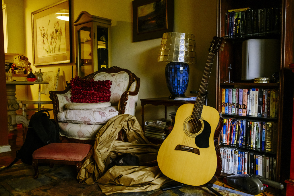 Audrey Woolfolk at Home Audrey Woolfolk keeps an acoustic guitar in her living room. Growing up, Julie used to take guitar lessons and loved playing music.