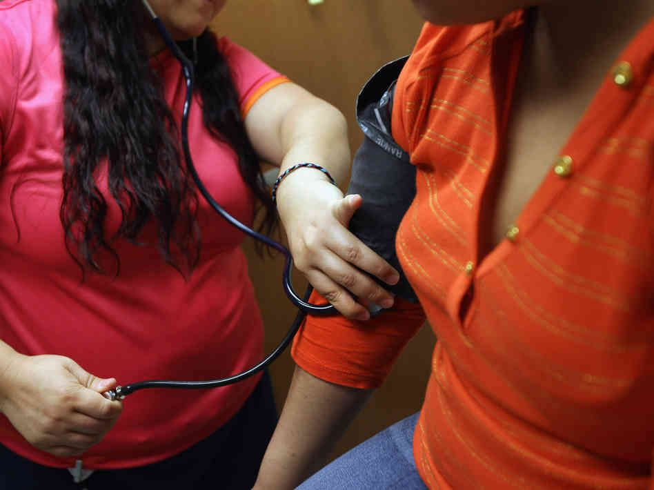 A medical assistant checks a patient's blood pressure. A new heath project, called the Health eHeart Study, will use sensors and other devices to gather data on things like blood pressure to better understand heart disease A medical assistant checks a patient's blood pressure. A new heath project, called the Health eHeart Study, will use sensors and other devices to gather data on things like blood pressure to better understand heart disease