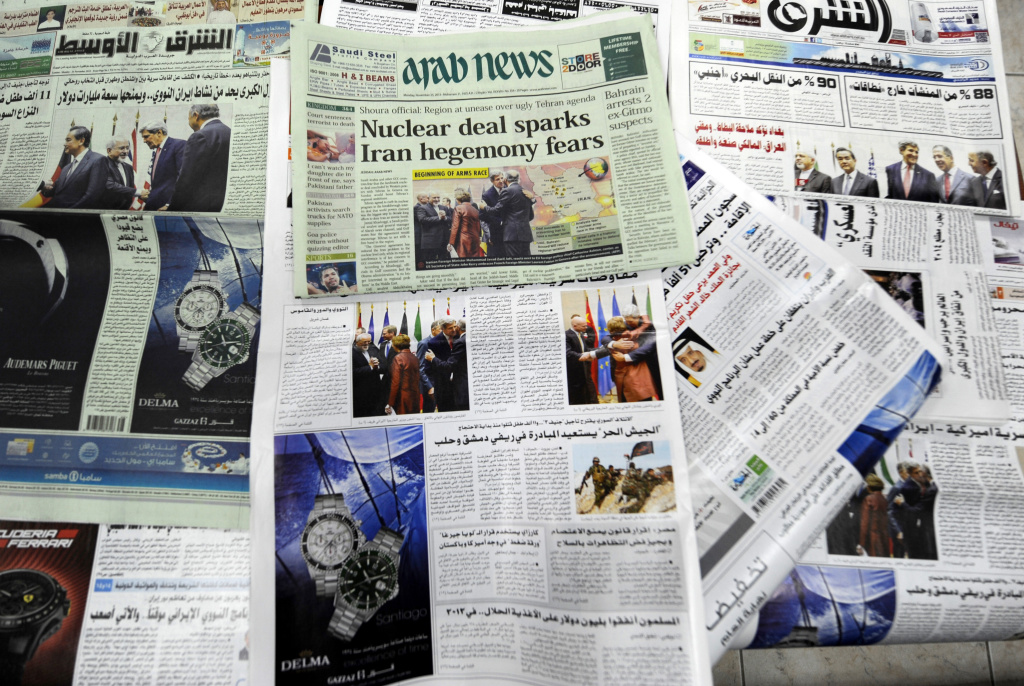 SAUDI-IRAN-NUCLEAR-MEDIA Saudi newspapers headlining the deal made with major powers over Iran's disputed nuclear deal are seen on November 25, 2013 in the capital Riyadh. The accord the United States and its allies welcomed will put Iran's nuclear enrichment program on hold as talks continue, but it marks only the first stage in fraught negotiations.