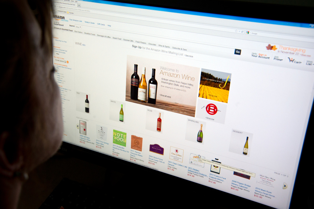 US-ONLINE-RETAIL-AMAZON-WINE A woman shops for wine on Amazon's Internet site on November 8, 2012 in Washington, DC. Amazon on Thursday launched an online wine store selling 'more than a thousand' varieties of US vintages. Amazon said the online shop would be 'a marketplace offering customers more than a thousand wines crafted by wineries around the country.' Wine sales are allowed only in states which allow it. That includes California, Connecticut, Florida, Idaho, Illinois, Iowa, Nebraska, Nevada, North Carolina, Oregon, Washington, Wyoming and the District of Columbia.
