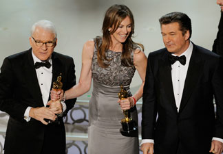 Director Kathryn Bigelow (C), winner of Best Director award for 'The Hurt Locker,' with co-hosts Steve Martin and Alec Baldwin, onstage during the 82nd Annual Academy Awards held at Kodak Theatre on March 7, 2010 in Hollywood, California.