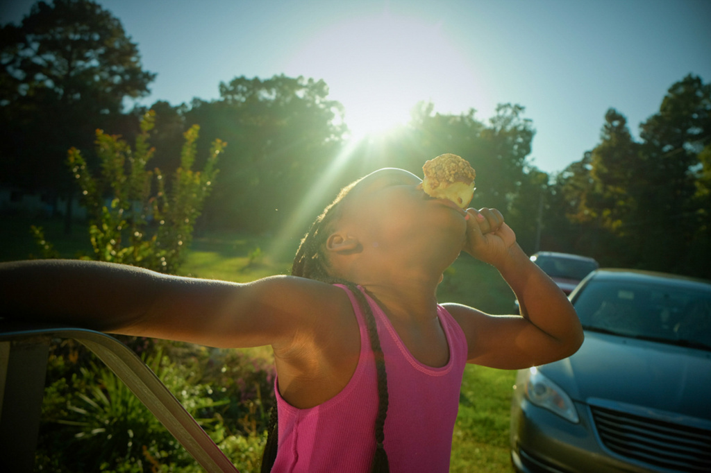 Instagram photographer The photographer's cousin Miyah eats a caramel apple days before Halloween. The picture is part of the series,
