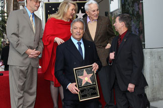 Maestro Zubin Mehta (L front row) and Leron Gubler/Emcee: Hollywood Chamber of Commerce, President/CEO, (from left back row) Sam Smith, Mrs. Zubin Mehta and actor Kirk Douglas pose for photographers during the installation ceremony for Zubin Mehta's star on the Hollywood Walk of Fame on March 1, 2011 in Hollywood, California.