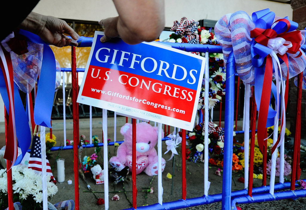 Safeway Reopens One Week After Shooting A campaign placard on a makeshift memorial set up at the site of a mass shooting in front of the Safeway grocery store in the La Toscana Village parking lot in Tucson, Arizona where six people died and several others were injured including Congresswoman Gabrielle Giffords in January of 2011.