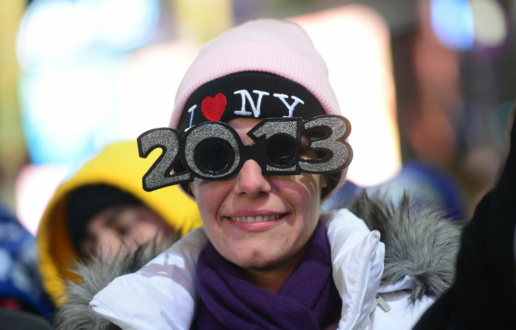 NEWYEAR-US-NEWYORK Revelers gather on Times Square on December 31, 2012 in New York City, where as many as a million people are expected to celebrate New Year's by viewing the traditional drop of a giant crystal ball -- and a billion more watching on TV around the world. With just a few hours to go before 2013, huge crowds assembled under the Manhattan neighborhood's famous neon advertising hoardings.