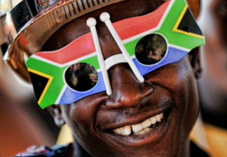 A South African welcomes the Chilean national football team's arrival Sunday.