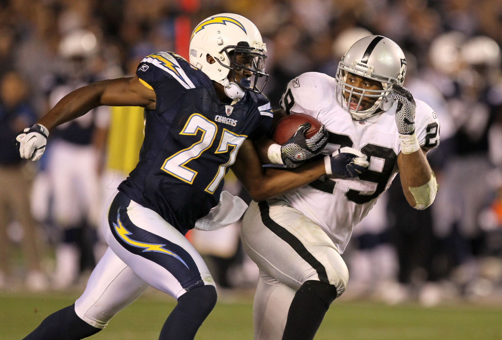 Oakland Raiders v San Diego Chargers SAN DIEGO, CA - NOVEMBER 10: Running back Michael Bush #29 of the Oakland Raiders carries the ball against safety Paul Oliver #27 of the San Diego Chargers at Qualcomm Stadium on November 10, 2011 in San Diego, California. The Raiders won 24-17. (Photo by Stephen Dunn/Getty Images)