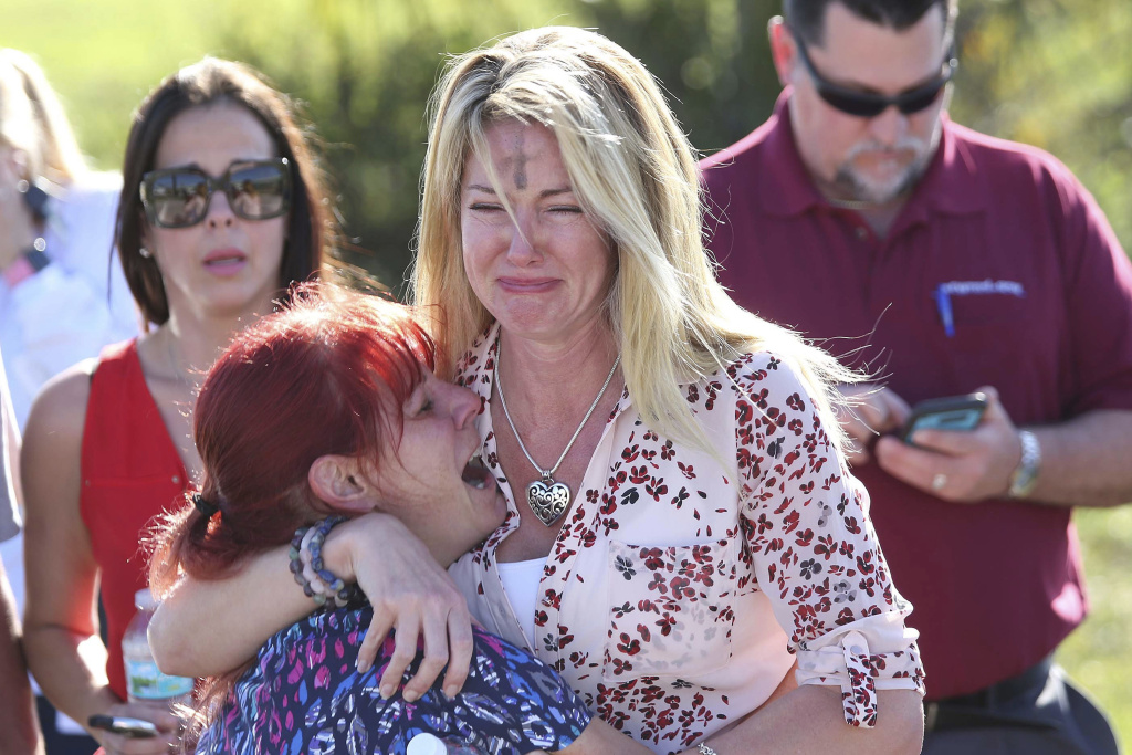 School Shooting Florida Parents wait for news after a reports of a shooting at Marjory Stoneman Douglas High School in Parkland, Fla., on Wednesday, Feb. 14, 2018.