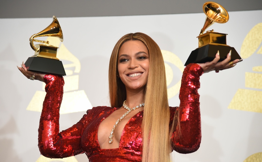 US-GRAMMY-MUSIC-PRESSROOM Singer Beyonce poses with her Grammy trophies in the press room during the 59th Annual Grammy music Awards on February 12, 2017, in Los Angeles, California.
