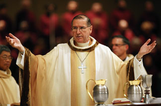 Cardinal Roger Mahony prepares to serve Holy Communion at the celebration of the Mass of the Lord's Supper, where he washed the feet of 12 people, following the example of Jesus washing the feet of his 12 apostles, at the Cathedral of Our Lady of the Angels April 9, 2009