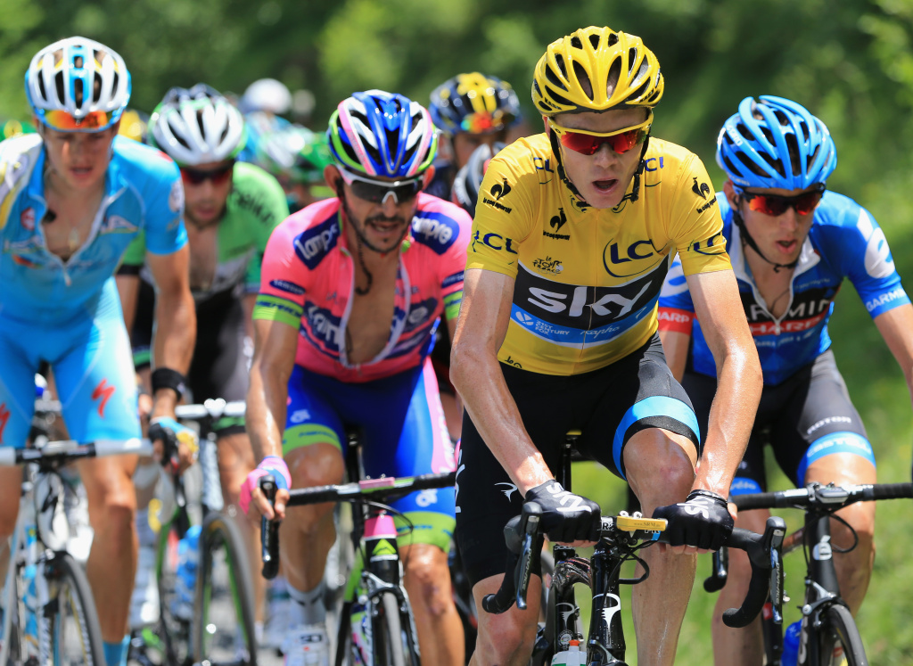 Le Tour de France 2013 - Stage Nine BAGNERES-DE-BIGORRE, FRANCE - JULY 07: Race leader Chris Froome (C) of Great Britain riding for Sky Procycling in action during stage nine of the 2013 Tour de France, a 168.5KM road stage from Saint-Girons to Bagneres-de-Bigorre, on July 7, 2013 in Bagneres-de-Bigorre, France.
