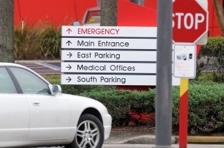 Mercer 20920 A car approaches a hospital emergency room. U.S. debate over health care continued Thursday as a court overturned a lawsuit claiming Obama's plan for reform was unconstitutional.