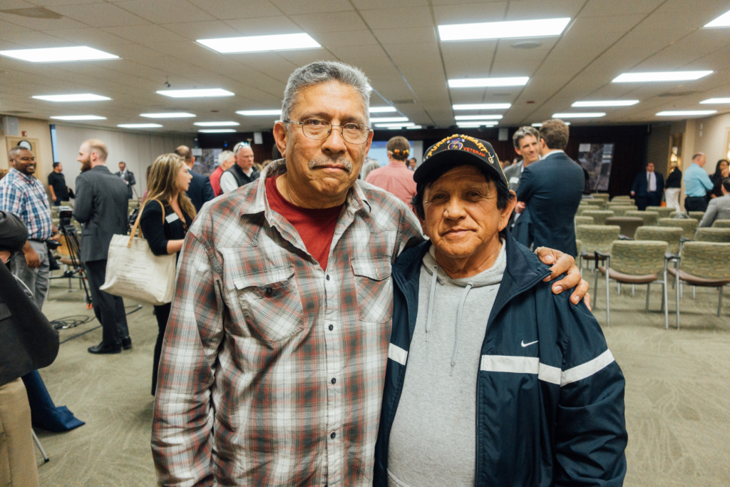 PTSD Clinic 256 patients Principal Developer Meeting Army veterans Raul Aguiar (right) and Arthur Gonzales (left) both served in Vietnam. They attended a hearing on the Principal Developer search for the West LA VA Campus to voice concerns about the relocation of the PTSD clinic in Building 256 they rely on for care.