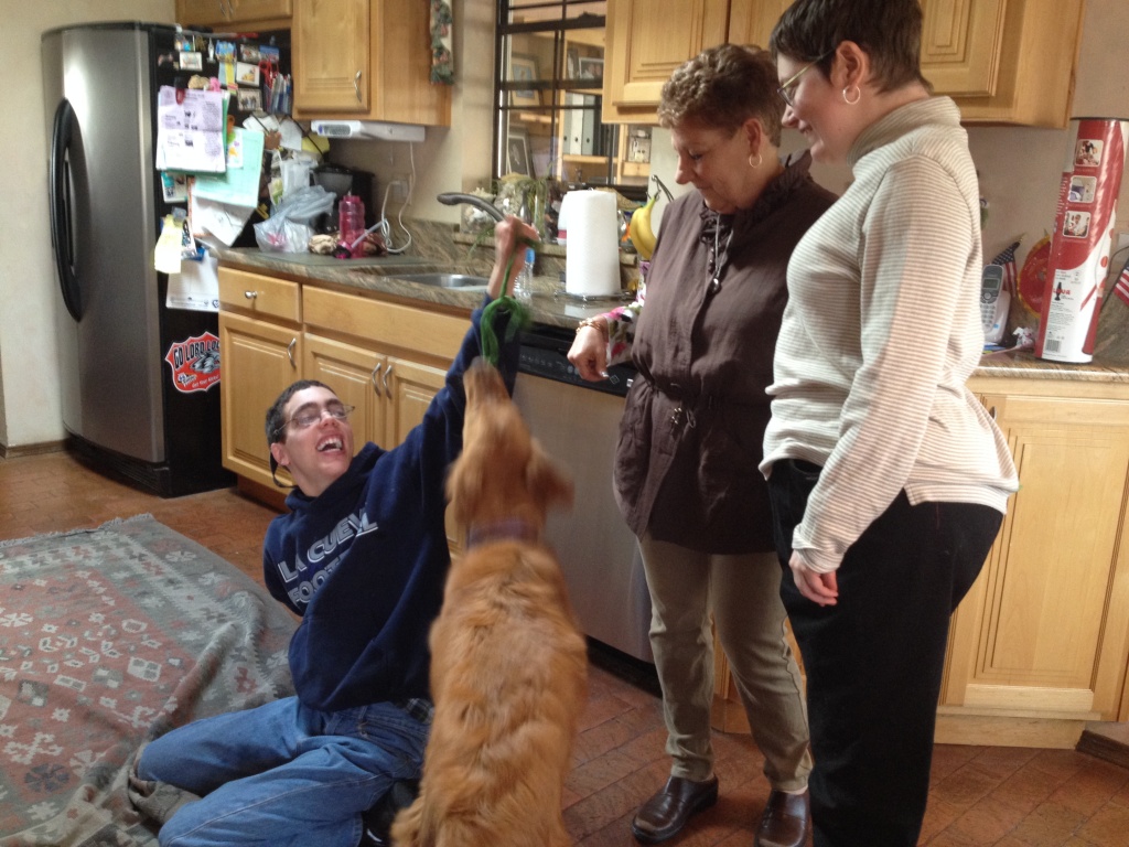 Deborah Martinez The Tatzes play with golden retriever Jelly Bean.