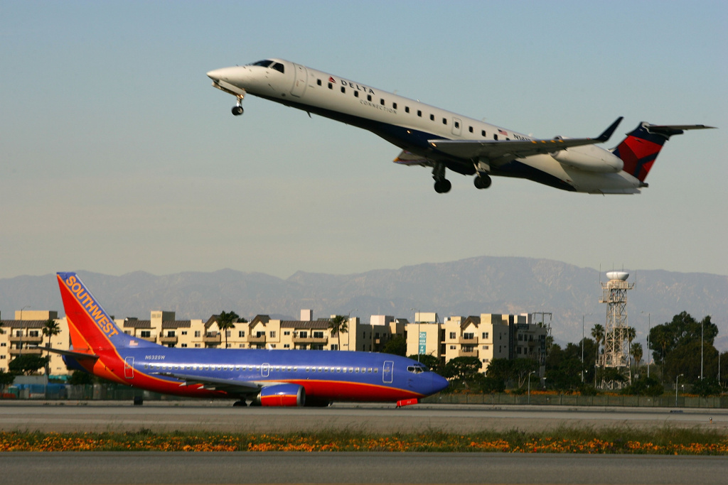 FAA Holds Los Angeles International Airport Airfield Tour Jets land and take off on runways at Los Angels International Airport (LAX) on February 26, 2008 in Los Angeles, California.