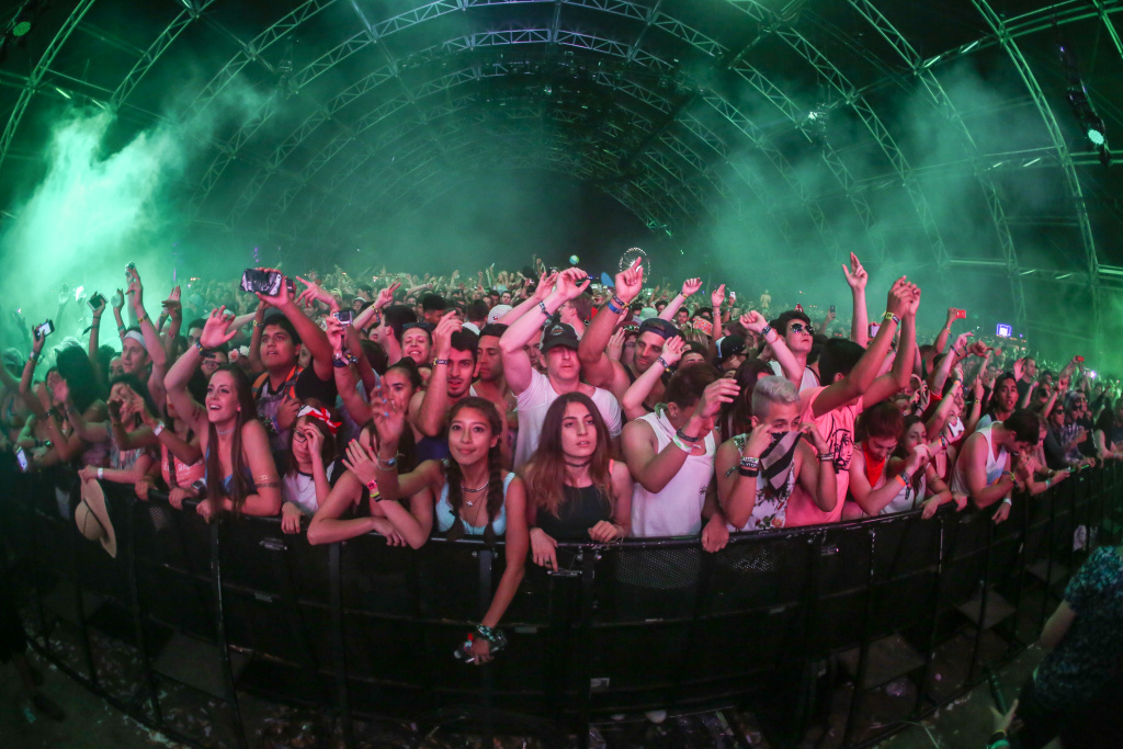 2015 Coachella Music And Arts Festival - Weekend 1 - Day 3 Festival goers enjoy the music in the Sahara Tent during David Guetta at the 2015 Coachella Music and Arts Festival on Sunday, April 12, 2015, in Indio, Calif. (Photo by Rich Fury/Invision/AP)