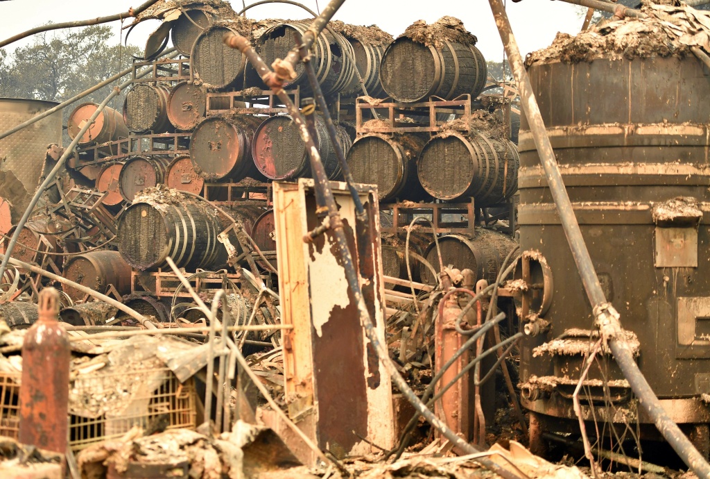 US-FIRE-CALIFORNIA Burned wine barrels are seen at the destroyed Paradise Ridge Winery in Santa Rosa, California on October 10, 2017.