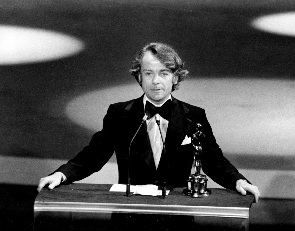 In this March 28, 1977, file photo, John G. Avildsen accepts the Oscar for best director for "Rocky" at the Academy Awards in Los Angeles. Avildsen, who directed "Rocky" and "The Karate Kid," the hugely successful underdog fables that went on to become Hollywood franchises, has died at age 81. Avildsen's son Anthony says his father died Friday, June 16, 2017, in Los Angeles from pancreatic cancer.