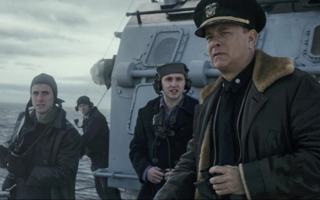 Michael Carollo (L) and Tom Hanks (R) in Greyhound. Michael Carollo (L) and Tom Hanks (R) in Greyhound.
