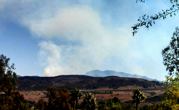 An image of the Baker Fire burning east of Santa Ana Sunday.