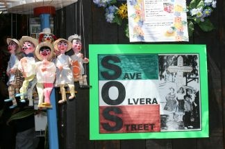 Posters saying "Save Olvera Street" greet visitors to the 80th anniversary celebrations of Olvera Street in downtown Los Angeles on on April 24, 2010.